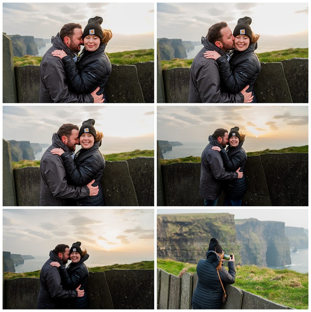 Couple snuggles on the Cliffs of Moher